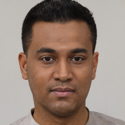 Neutral latino young-adult male with short  black hair and brown eyes