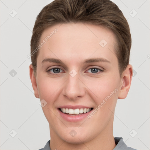 Joyful white young-adult female with short  brown hair and grey eyes