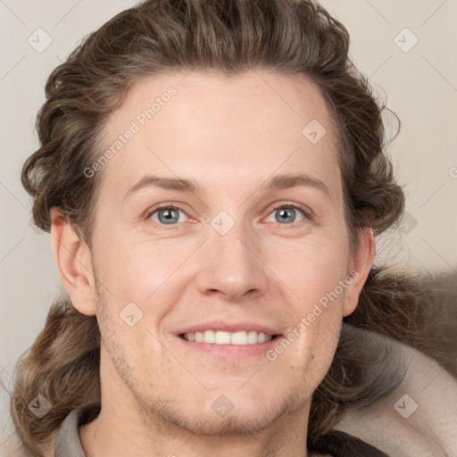 Joyful white adult male with short  brown hair and grey eyes