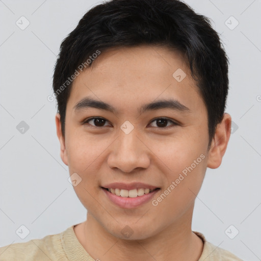 Joyful asian young-adult male with short  brown hair and brown eyes