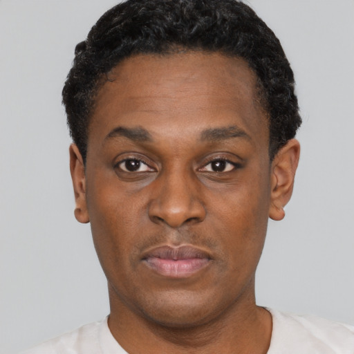 Neutral black young-adult male with short  black hair and brown eyes