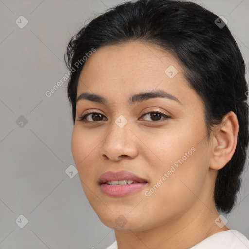 Joyful asian young-adult female with medium  black hair and brown eyes