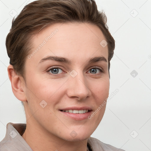 Joyful white young-adult female with short  brown hair and grey eyes