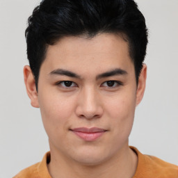 Joyful asian young-adult male with short  brown hair and brown eyes