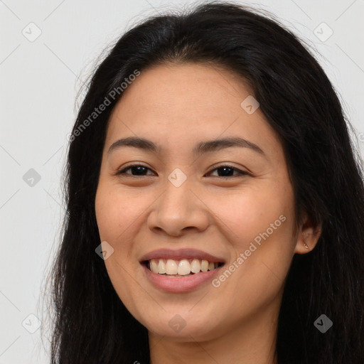 Joyful asian young-adult female with long  brown hair and brown eyes