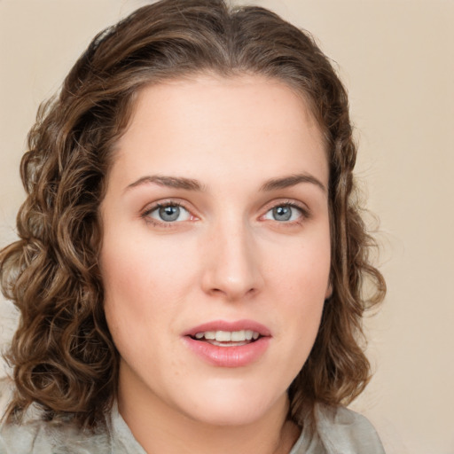 Joyful white young-adult female with medium  brown hair and green eyes