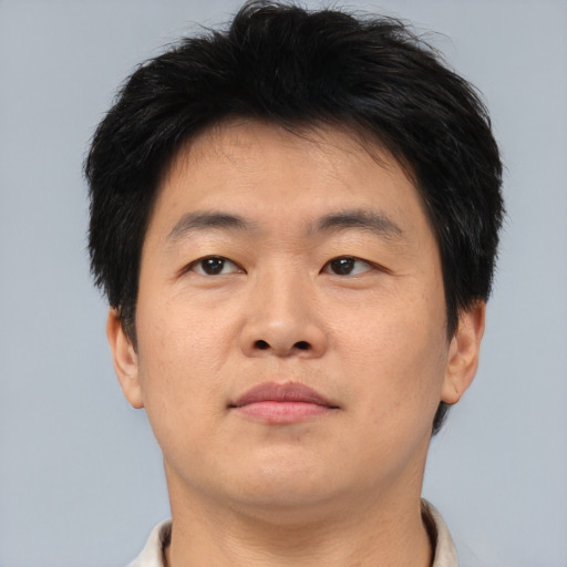 Neutral asian young-adult male with short  brown hair and brown eyes