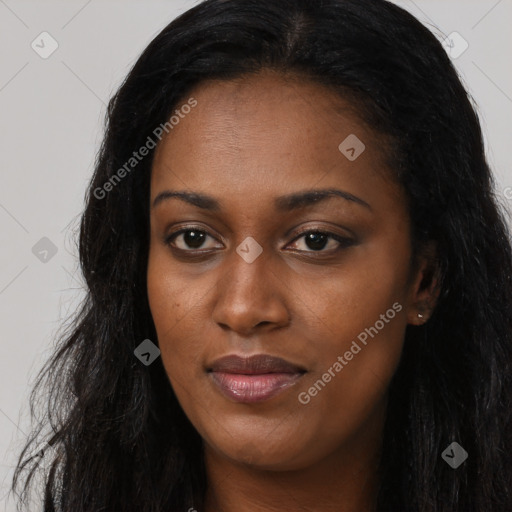 Joyful black young-adult female with long  black hair and brown eyes