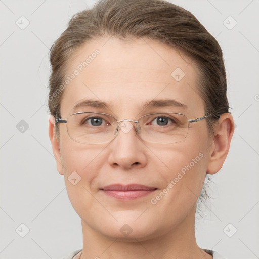 Joyful white adult female with short  brown hair and grey eyes