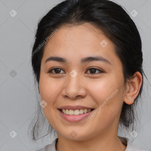 Joyful asian young-adult female with medium  brown hair and brown eyes