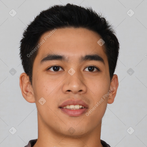 Joyful asian young-adult male with short  black hair and brown eyes