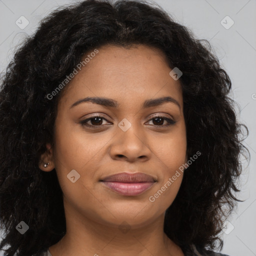 Joyful black young-adult female with long  brown hair and brown eyes