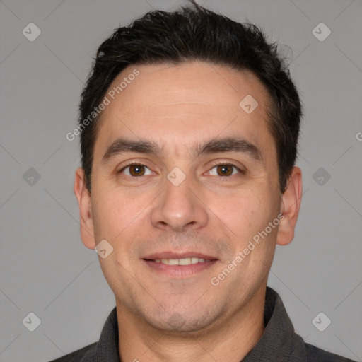 Joyful white adult male with short  black hair and brown eyes