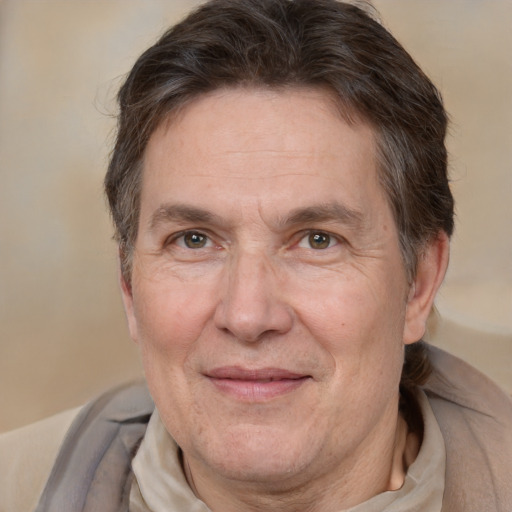 Joyful white middle-aged male with short  brown hair and brown eyes