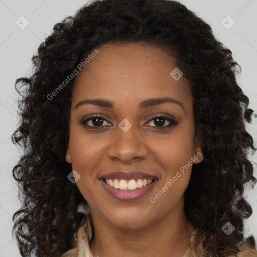 Joyful black young-adult female with long  brown hair and brown eyes