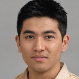 Joyful asian young-adult male with short  black hair and brown eyes