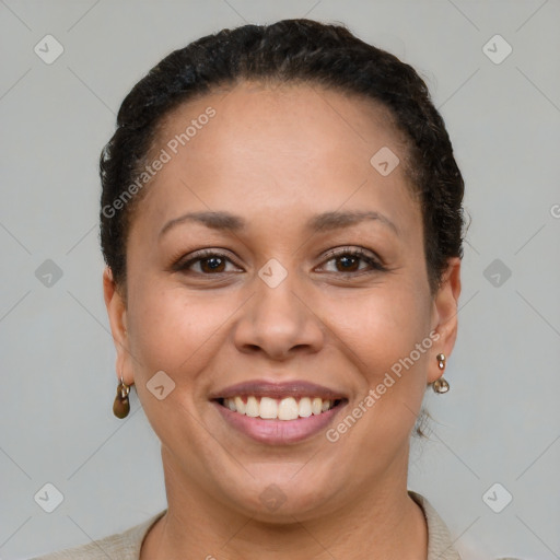 Joyful black young-adult female with short  brown hair and brown eyes