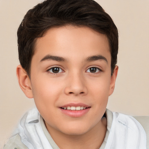 Joyful white child male with short  brown hair and brown eyes