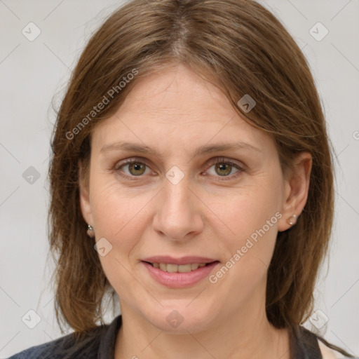 Joyful white adult female with medium  brown hair and grey eyes