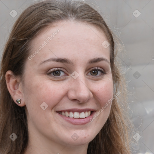 Joyful white adult female with long  brown hair and grey eyes