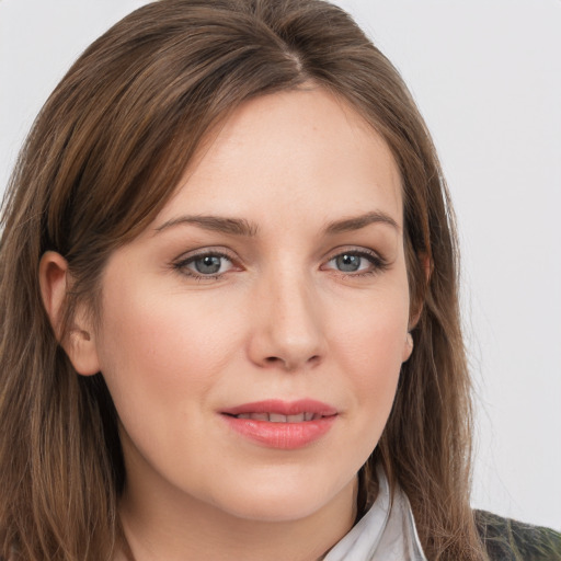 Joyful white young-adult female with long  brown hair and grey eyes