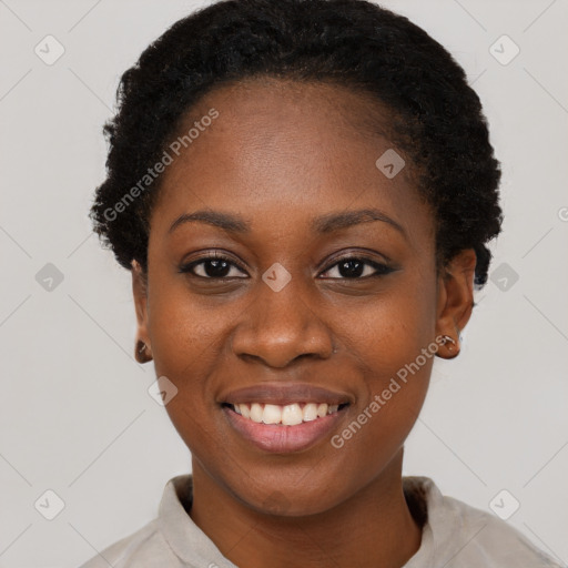 Joyful black young-adult female with short  black hair and brown eyes