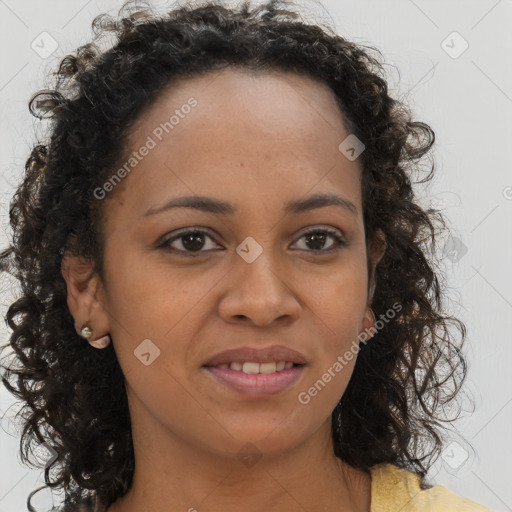 Joyful black young-adult female with long  brown hair and brown eyes