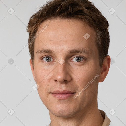 Joyful white adult male with short  brown hair and grey eyes