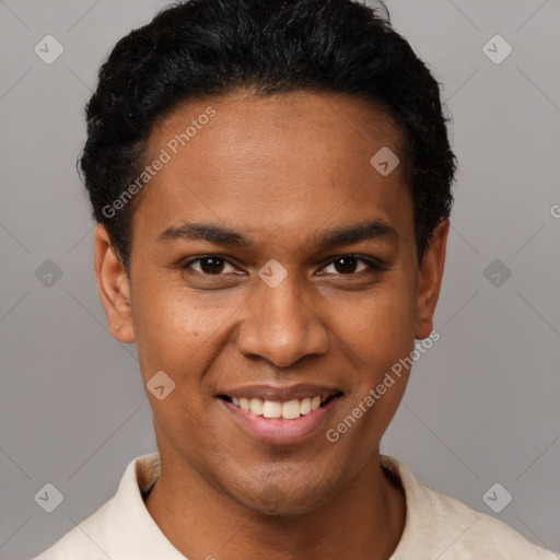 Joyful black young-adult male with short  brown hair and brown eyes