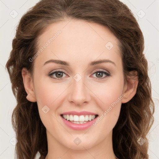 Joyful white young-adult female with long  brown hair and green eyes