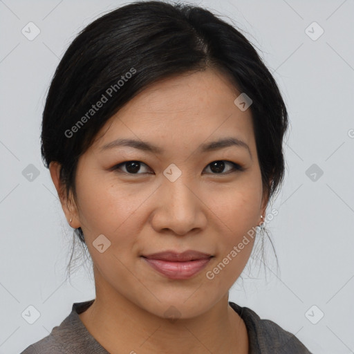 Joyful asian young-adult female with medium  black hair and brown eyes