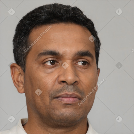 Neutral latino adult male with short  brown hair and brown eyes