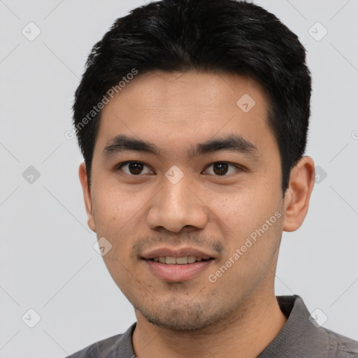 Joyful asian young-adult male with short  black hair and brown eyes