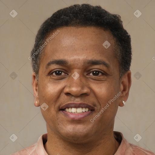 Joyful latino adult male with short  brown hair and brown eyes