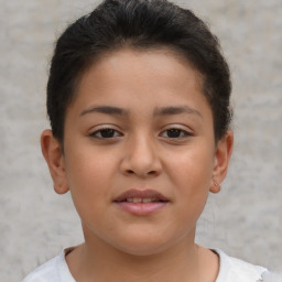 Joyful white child female with short  brown hair and brown eyes