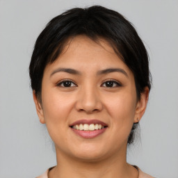 Joyful asian young-adult female with medium  brown hair and brown eyes