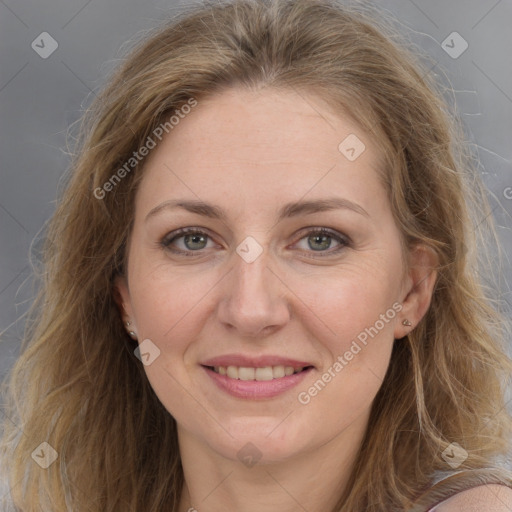 Joyful white adult female with long  brown hair and grey eyes