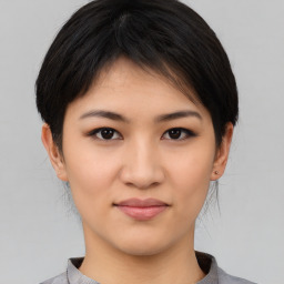 Joyful asian young-adult female with medium  black hair and brown eyes