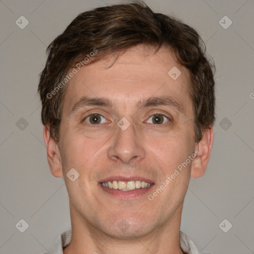 Joyful white adult male with short  brown hair and grey eyes