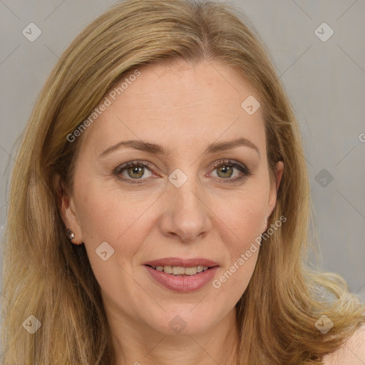 Joyful white adult female with long  brown hair and brown eyes