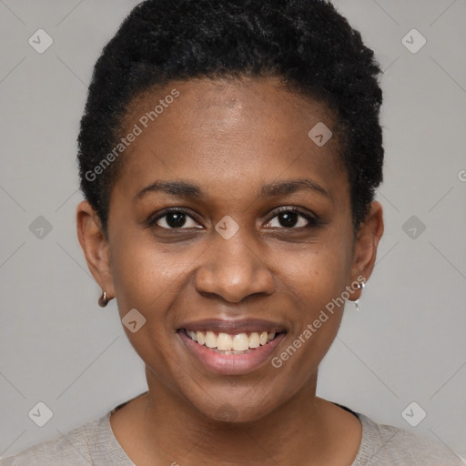 Joyful black young-adult female with short  black hair and brown eyes