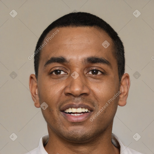 Joyful black young-adult male with short  black hair and brown eyes