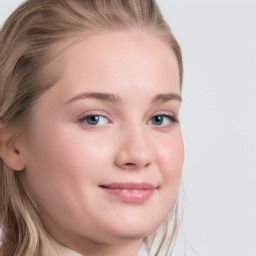 Joyful white young-adult female with long  brown hair and blue eyes