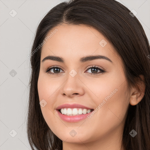 Joyful white young-adult female with long  brown hair and brown eyes