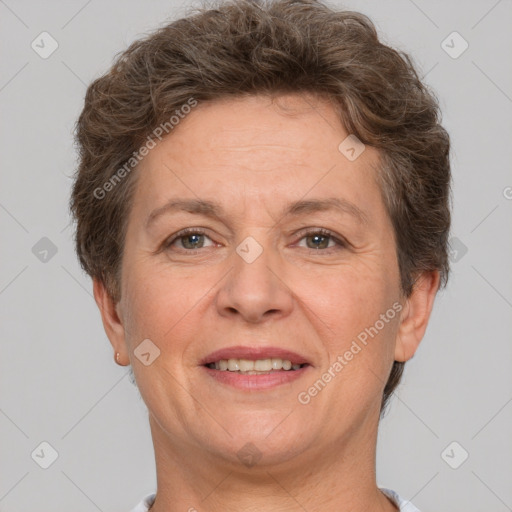 Joyful white adult female with short  brown hair and brown eyes