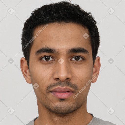 Neutral latino young-adult male with short  black hair and brown eyes