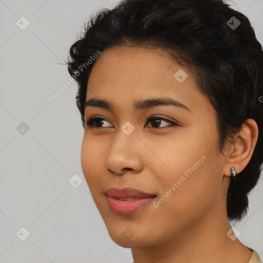 Joyful latino young-adult female with short  black hair and brown eyes