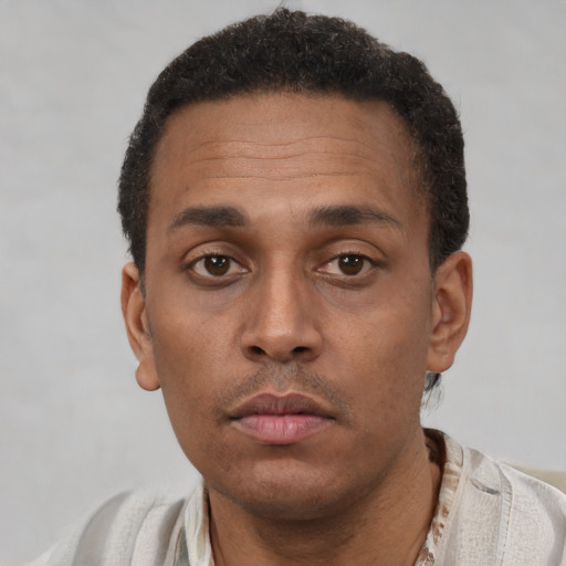 Neutral latino young-adult male with short  brown hair and brown eyes