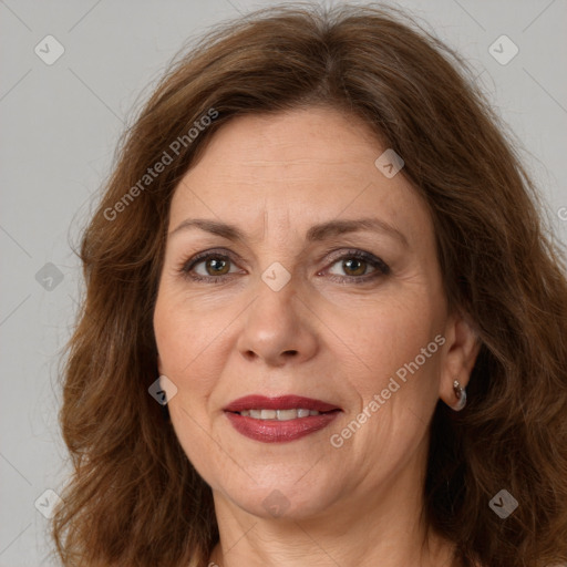 Joyful white adult female with long  brown hair and brown eyes