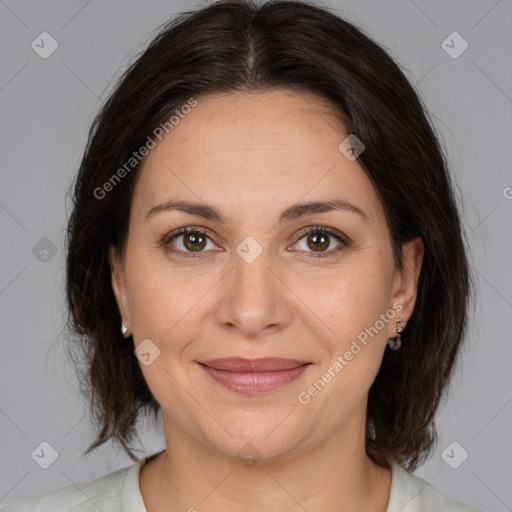 Joyful white adult female with medium  brown hair and brown eyes